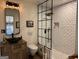 Modern bathroom featuring a black framed glass shower and vessel sink at 363 Palmetto Rd, Tyrone, GA 30290