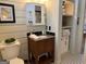 Bathroom with granite countertop, patterned floors, and built-in shelving at 363 Palmetto Rd, Tyrone, GA 30290