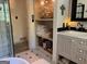 Bathroom features a vanity with drawers, and a built-in open shelf cabinet at 363 Palmetto Rd, Tyrone, GA 30290