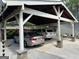Covered carport featuring stone pillars and two parked vehicles at 363 Palmetto Rd, Tyrone, GA 30290