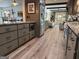Bright kitchen features gray cabinets, stainless steel appliances and light wood flooring at 363 Palmetto Rd, Tyrone, GA 30290
