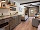Kitchen with gray cabinets, granite countertops, stainless steel appliances, and dining area with seating at 363 Palmetto Rd, Tyrone, GA 30290