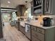 Well-appointed kitchen featuring gray cabinets, granite countertops, stainless steel appliances, and open layout at 363 Palmetto Rd, Tyrone, GA 30290