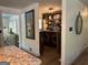 View of the laundry room, which includes a washer and dryer, shelving, and storage cabinets at 363 Palmetto Rd, Tyrone, GA 30290