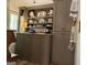 A well-organized laundry room with built-in shelves and storage cabinets at 363 Palmetto Rd, Tyrone, GA 30290