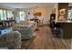 Spacious living room showcasing the seating area, dining table, and open layout with lots of natural light at 363 Palmetto Rd, Tyrone, GA 30290