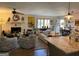 Open-concept living area showing the fireplace, seating, dining area, and view into the kitchen at 363 Palmetto Rd, Tyrone, GA 30290