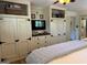Bedroom with custom shelving around a flat-screen TV for optimal bedroom storage at 363 Palmetto Rd, Tyrone, GA 30290