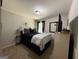 Bedroom with cozy bed, stylish decorations, and window for ample natural light at 6539 Saint Mark Way, Fairburn, GA 30213