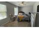 Bright bedroom with natural light, carpeted floor, and ceiling fan at 6539 Saint Mark Way, Fairburn, GA 30213