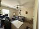 Bedroom featuring a couch, plush rug, wall art, and a computer station in a versatile and stylish atmosphere at 6539 Saint Mark Way, Fairburn, GA 30213