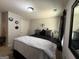 Comfortable bedroom with a black bed, stylish decor, and soft, cozy bedding at 6539 Saint Mark Way, Fairburn, GA 30213