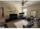 Bedroom space with a cozy couch, white rug, a TV, wall decor, and a corner computer space, creating a versatile and stylish atmosphere at 6539 Saint Mark Way, Fairburn, GA 30213
