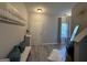 Bright entryway featuring modern decor, a stylish mirror, and durable flooring at 6539 Saint Mark Way, Fairburn, GA 30213