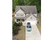 Charming home featuring a 2-car garage, well-maintained lawn, and a welcoming front porch at 6539 Saint Mark Way, Fairburn, GA 30213