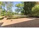 Inviting backyard deck featuring built-in benches with scenic views of the lake and natural surroundings at 30 Circle Dr, Hampton, GA 30228
