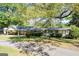 Charming single-story home with a covered carport, well-maintained landscaping, and an inviting facade at 30 Circle Dr, Hampton, GA 30228