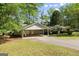 Well-kept single-story home featuring a carport, tidy landscaping, and a welcoming curb appeal at 30 Circle Dr, Hampton, GA 30228
