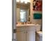 Bathroom features a white single sink vanity, modern fixtures, and neutral wall color at 160 Elysian Dr, Fayetteville, GA 30214