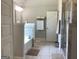 Bathroom featuring a tub, shower, and neutral tile flooring at 160 Elysian Dr, Fayetteville, GA 30214