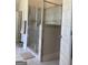Bathroom featuring glass shower with tile and an open doorway at 160 Elysian Dr, Fayetteville, GA 30214