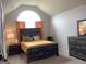 Vaulted ceiling bedroom with large window and rustic wood furnishings, offering comfort and charm at 160 Elysian Dr, Fayetteville, GA 30214