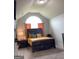 Bedroom with vaulted ceiling, illuminated by a large window and stylish furnishings at 160 Elysian Dr, Fayetteville, GA 30214