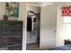 Bedroom closet showing storage solutions and a dresser with decorative items at 160 Elysian Dr, Fayetteville, GA 30214