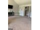 Bedroom with TV, neutral decor, and an open doorway to another room at 160 Elysian Dr, Fayetteville, GA 30214