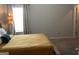 Well-lit bedroom featuring vaulted ceiling, soft curtains, and easy access to the closet at 160 Elysian Dr, Fayetteville, GA 30214