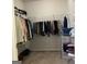 Spacious walk-in closet with hanging clothes and shoe rack at 160 Elysian Dr, Fayetteville, GA 30214