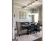Elegant dining room with coffered ceiling, custom seating, and decorative wall art at 160 Elysian Dr, Fayetteville, GA 30214