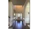 Bright and inviting foyer features hardwood floors, soaring ceilings, and elegant wainscoting at 160 Elysian Dr, Fayetteville, GA 30214
