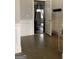 Inviting hallway features hardwood floors, paneled walls, and an open doorway to the garage at 160 Elysian Dr, Fayetteville, GA 30214