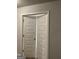 View through white paneled double doors to another room, showing neutral color scheme at 160 Elysian Dr, Fayetteville, GA 30214