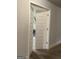 Hallway view of an open white five-panel door, carpeted floor, and neutral paint at 160 Elysian Dr, Fayetteville, GA 30214