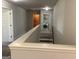 Upstairs hallway featuring laundry area with modern appliances and neutral decor at 160 Elysian Dr, Fayetteville, GA 30214
