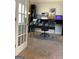 Bright home office features modern desk, decor and white french door entrance at 160 Elysian Dr, Fayetteville, GA 30214