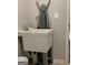 Laundry room sink area featuring a large utility sink and ironing board at 160 Elysian Dr, Fayetteville, GA 30214