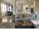 Open living area showcasing hardwood floors, comfortable seating, and seamless flow into the modern kitchen at 160 Elysian Dr, Fayetteville, GA 30214