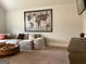 Living room featuring a stylish world map art piece and a comfortable sectional sofa at 160 Elysian Dr, Fayetteville, GA 30214
