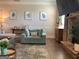 Comfortable living room with hardwood floors, a stone fireplace, and stylish decor at 160 Elysian Dr, Fayetteville, GA 30214