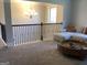 Second story living room features neutral carpet, and an oversized sectional sofa at 160 Elysian Dr, Fayetteville, GA 30214