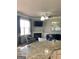 Open-concept living room featuring granite countertops, fireplace, and a comfortable seating area at 160 Elysian Dr, Fayetteville, GA 30214
