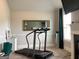 Living area including exercise equipment and cozy fireplace at 160 Elysian Dr, Fayetteville, GA 30214