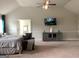 Bright main bedroom featuring a media center, TV, and a calming color palette at 160 Elysian Dr, Fayetteville, GA 30214