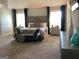 Expansive main bedroom with large windows, a sitting area, and stylish furnishings at 160 Elysian Dr, Fayetteville, GA 30214