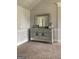 Bedroom decor features a mirrored dresser with matching silver accents at 160 Elysian Dr, Fayetteville, GA 30214
