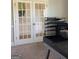Well-lit office space featuring french doors and contemporary decor at 160 Elysian Dr, Fayetteville, GA 30214