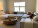 Living room with sectional sofa and large window providing ample natural light at 160 Elysian Dr, Fayetteville, GA 30214